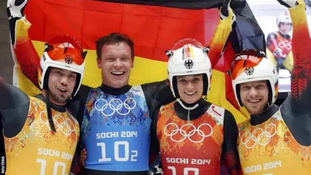 Tobias Arlt, Felix Loch, Natalie Geisenberger and Tobias Wendt celebrate