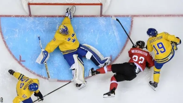 Switzerland's Nino Niederreiter tries to score against Sweden