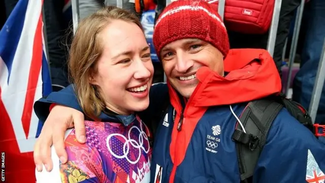 Lizzy Yarnold of Great Britain celebrates winning the gold medal with her boyfriend and coach James Roach.