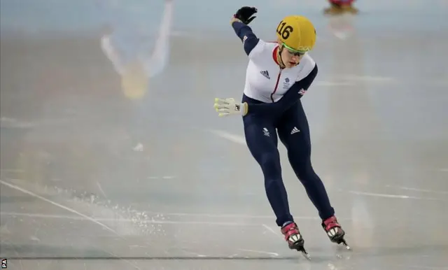 Elise Christie skates around the finish line