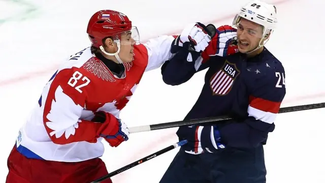 Evgeny Medvedev of Russia fights with Ryan Callahan of United States