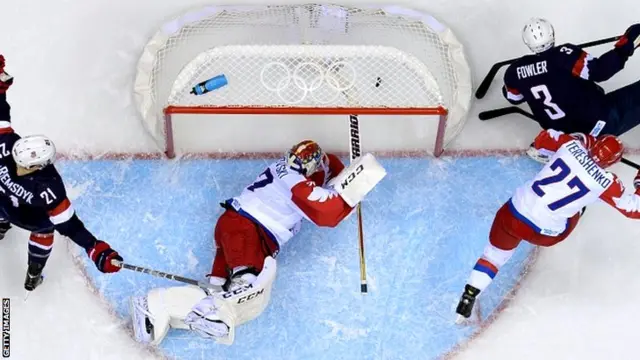 US James van Riemsdyk (L) celebrates as US Cam Fowler (R) scores against Russia's Alexei Tereshchenko