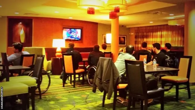 The US Sledge Hockey team watch the action from Sochi