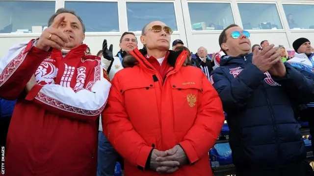 Russia's President Vladimir Putin (C), Prime Minister Dmitry Medvedev (R) and Sports Minister Vitaly Mutko (L)