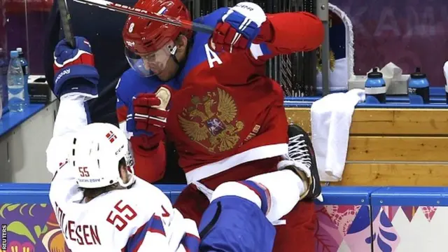 Russia's Alexander Ovechkin (R) hits Norway's Ole-Kristian Tollefsen