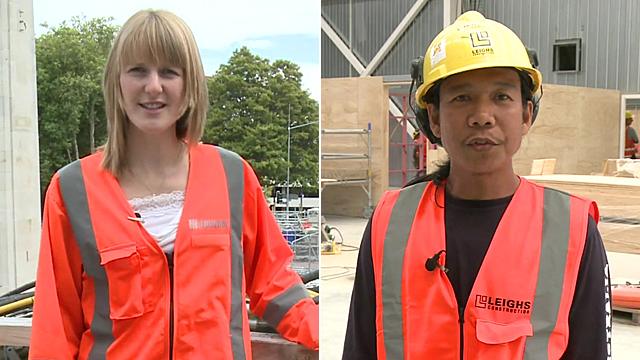 Scottish woman and Filipino man in orange work vests