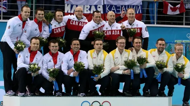 The teams at the flower ceremony