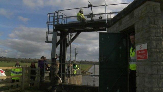 Workers raising the Monksleaze sluice gate near Langport