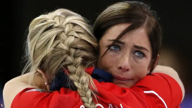 Eve Muirhead and Anna Sloan embrace