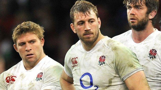 England captain Chris Robshaw (centre) looks on after last year's defeat in Wales