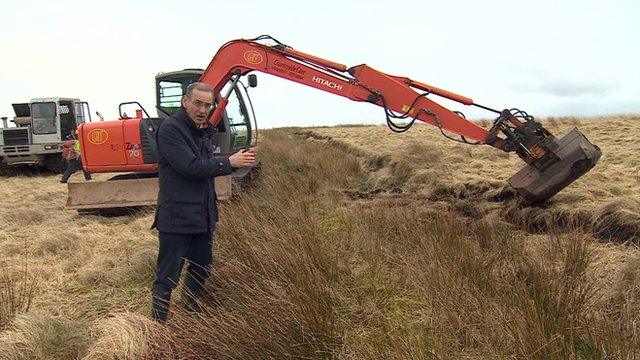 Roger Harrabin and a digger