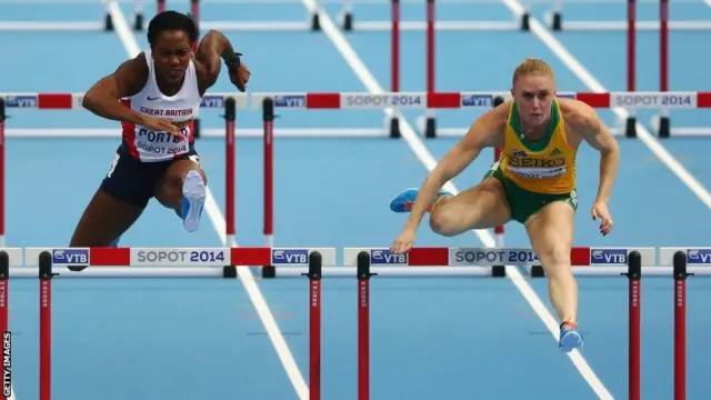 Sally Pearson of Australia competes with Tiffany Porter of Great Britain