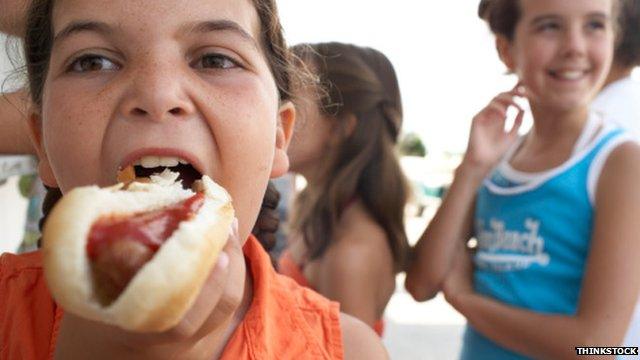 Children at a hot dog stall