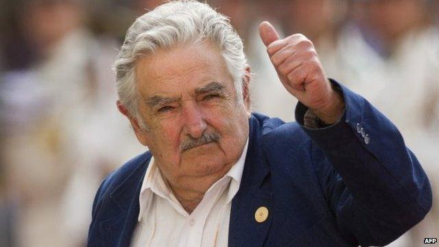 Uruguay's president Jose Mujica gives his thumb up at the press in Chile, on March 10, 2014