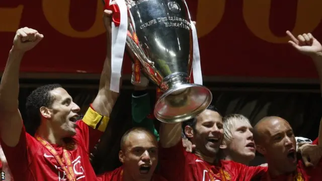 Manchester United's players lift the European Cup in Moscow.