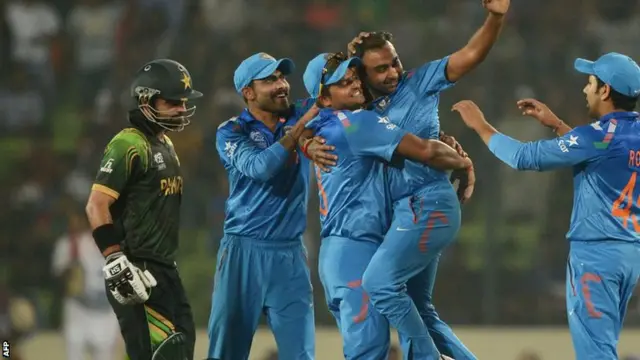 India's cricketers celebrate a wicket