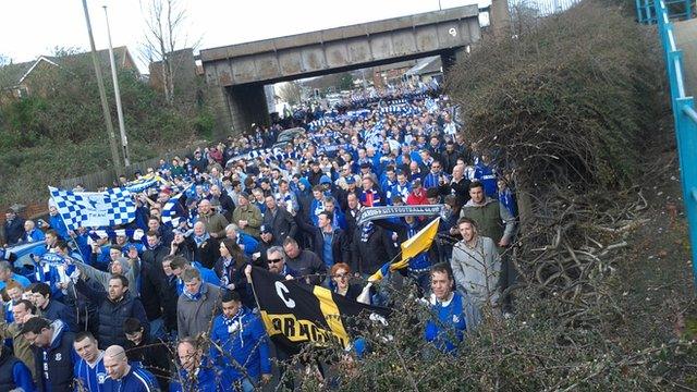 Cardiff City fans march in protest