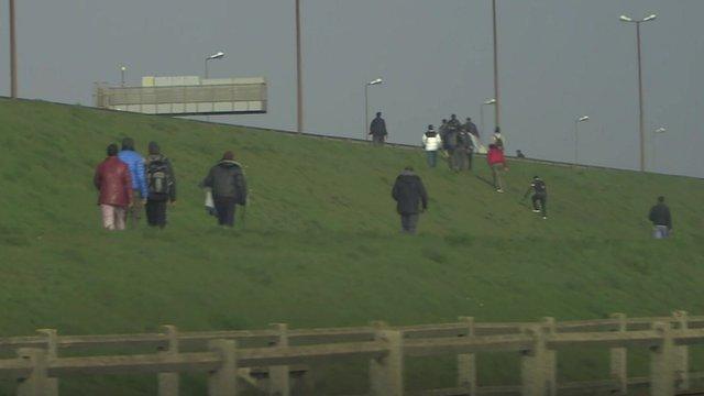 Illegal migrants trying to board UK-bound lorries in Calais