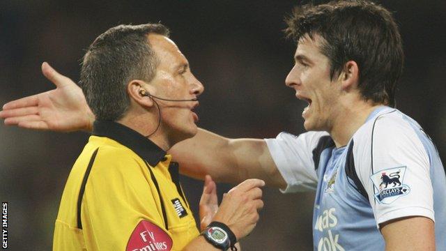 Joey Barton makes a point to referee Alan Wiley playing for Manchester City in 2007