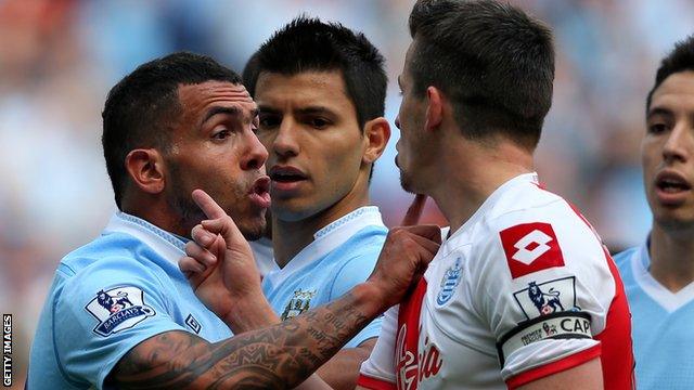 QPR midfielder Joey Barton is confronted by then Manchester City striker Carlos Tevez in 2012