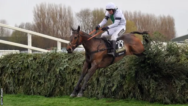 Leighton Aspell riding Pineau De Re to victory in the Grand National