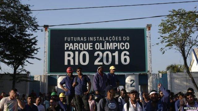 Construction workers on strike stand outside the Rio 2016 Olympic Park construction site in Rio de Janeiro April 8, 2014.