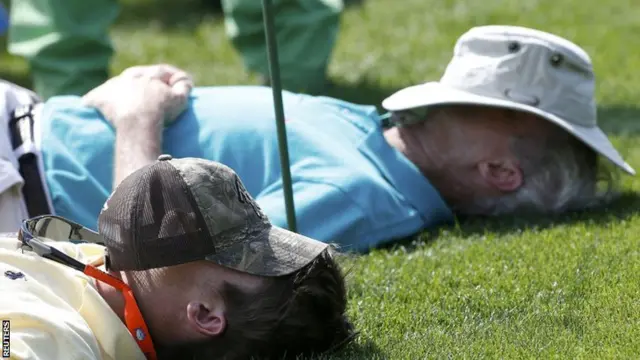 Patrons sleep on the 15th tee