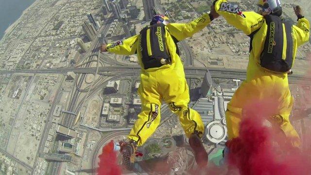 View as sky divers jump from Burj Khalifa