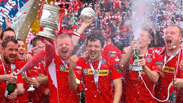 Cliftonville players celebrate lifting the Gibson Cup at Solitude