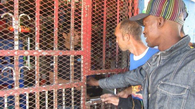 Customers at one of South Africa's spaza small shops