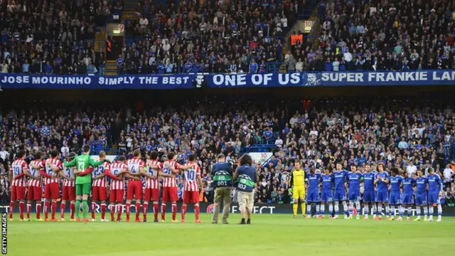 The teams line up to observe a silence in memory of former FC Barcelona coach Tito Vilanova