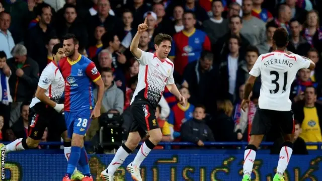 Joe Allen of Liverpool celebrates after scoring the opening goal during the Barclays Premier League match between Crystal Palace and Liverpool at Selhurst Park