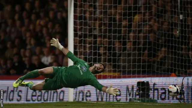 The ball flys past Crystal Palace's Argentinian goalkeeper Julian Speroni