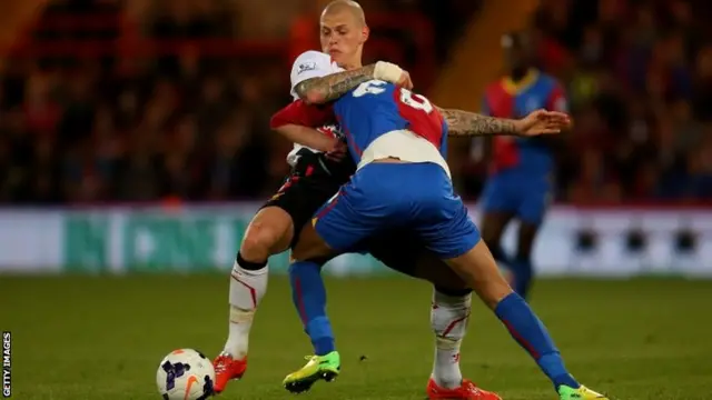 Martin Skrtel of Liverpool and Marouane Chamakh of Crystal Palace battle for the ball