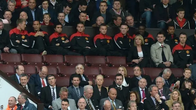 Manchester United players sat in stands