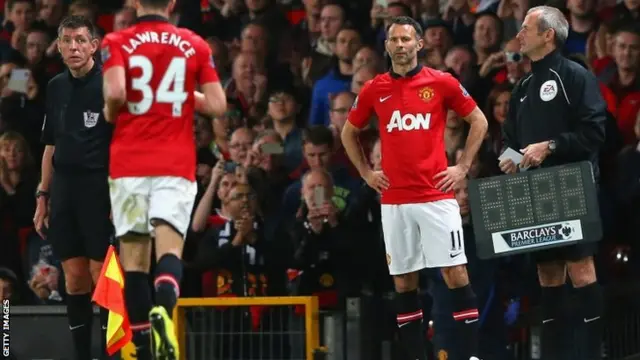 Manchester United Caretaker Manager Ryan Giggs prepares to come on Lawrence