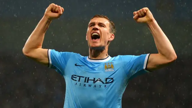 Edin Dzeko celebrates his second goal against Aston Villa