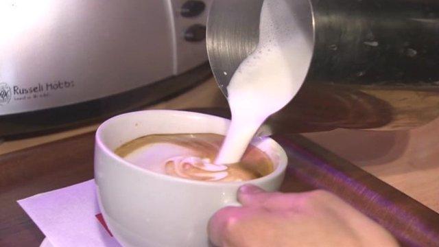 Milk poured in to coffee