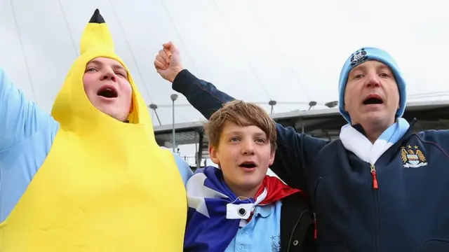 Manchester City fans sing on the final day of the season