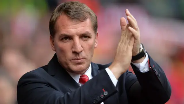 Liverpool manager Brendan Rodgers applauds the fans