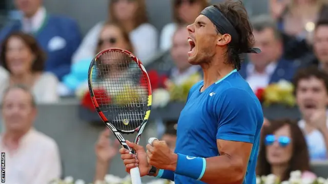 Rafael Nadal celebrates winning the Madrid Masters tennis