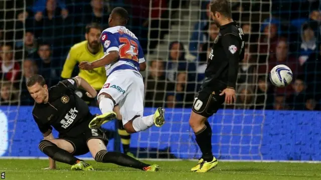 Wigan's Gary Caldwell fouls QPR's Junior Hoilett