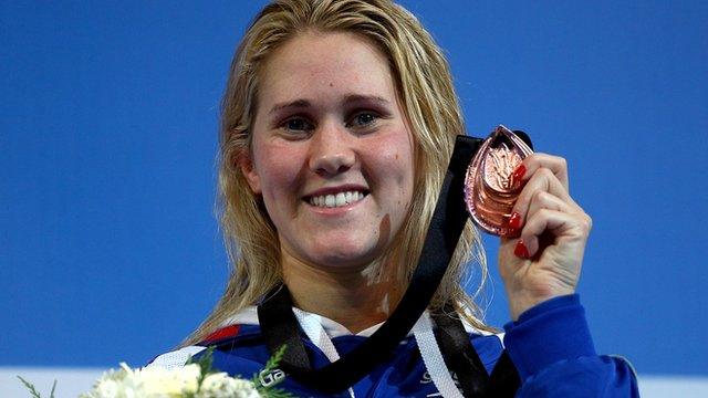 Jemma Lowe holding her bronze medal