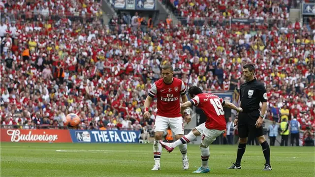 Santi Cazorla scores for Arsenal in the FA Cup final against Hull City