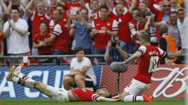 Aaron Ramsey celebrates scoring Arsenal's third goal of the afternoon