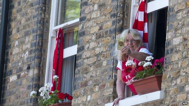 One fan watching from a window