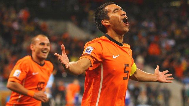 Netherlands captain Giovanni van Bronckhorst scores at the 2010 World Cup