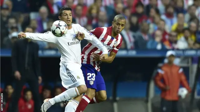 Cristiano Ronaldo battles to keep hold of the ball