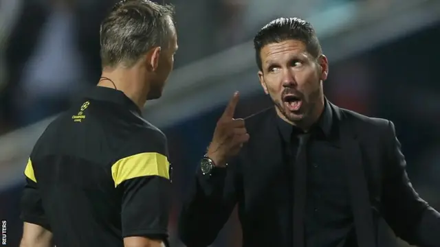 Diego Simeone speaks to the referee