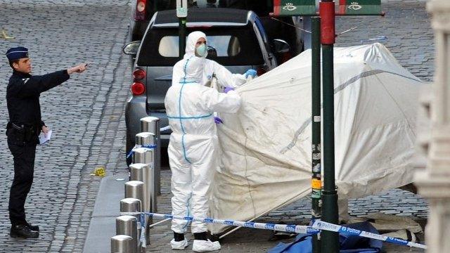 Police personnel are seen at the site of a shooting in central Brussels May 24, 2014